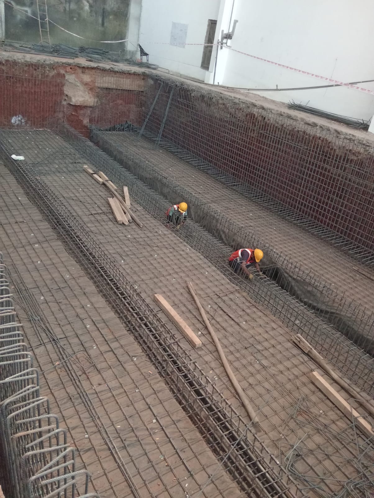 Rebar reinforcement work at construction site in Belagavi