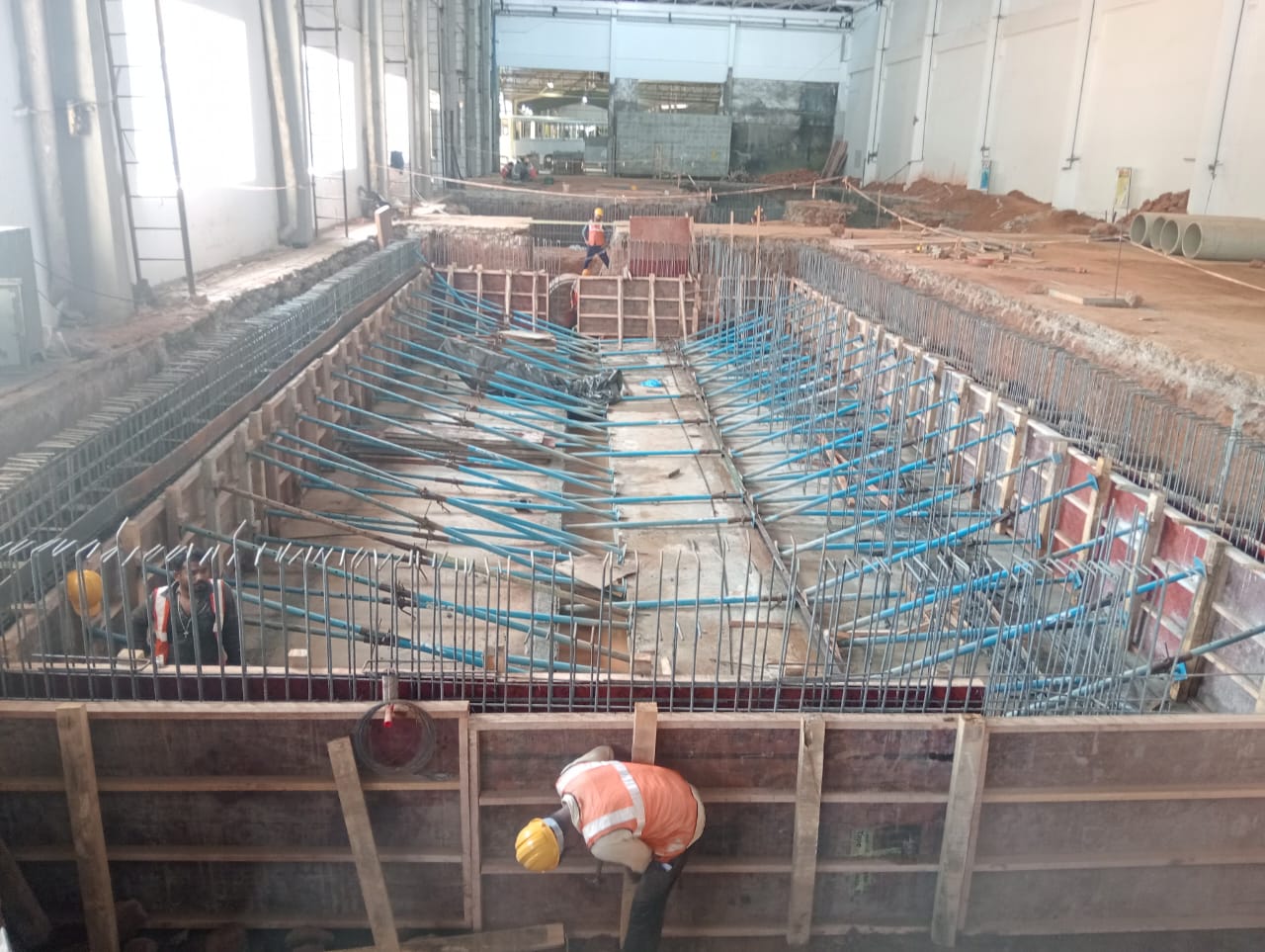 Formwork and reinforcement at industrial building site in Belagavi